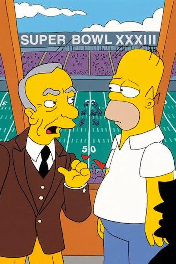 Rupert Murdoch dans un moment animé avec Homer Simpson.