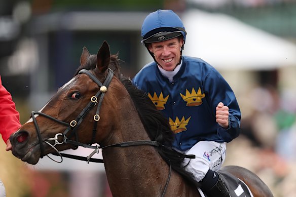 John Allen sourit après avoir remporté le VRC Oaks sur Strictly Business.