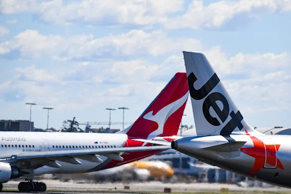 Avions Qantas et Jetstar à l'aéroport de Sydney. La compagnie aérienne met à disposition un grand nombre de sièges pour voyageurs fréquents.