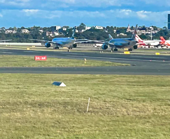 Le goulot d'étranglement à l'atterrissage à l'aéroport de Sydney oblige les avions à brûler du carburant pendant les contournements et le roulage sur la piste